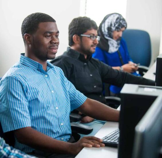 Computer science students working at computers