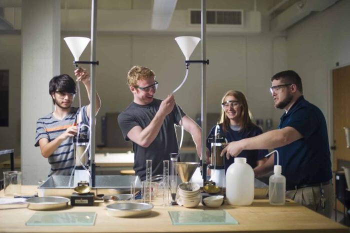 Student preforming lab experiment.