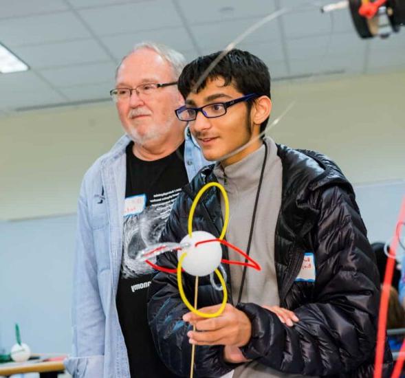 Student carrying science project.