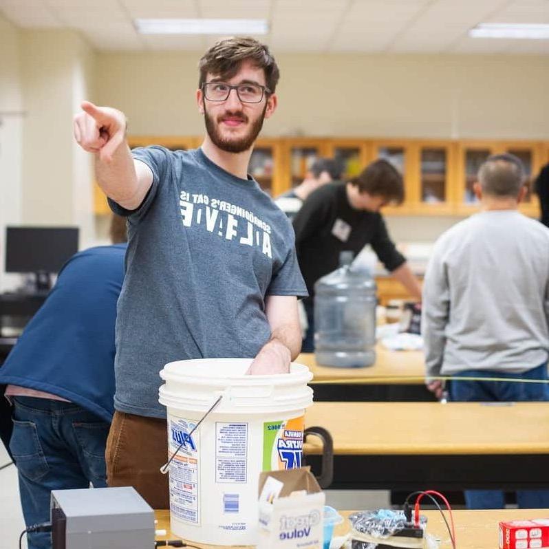 Student preforming lab experiment.